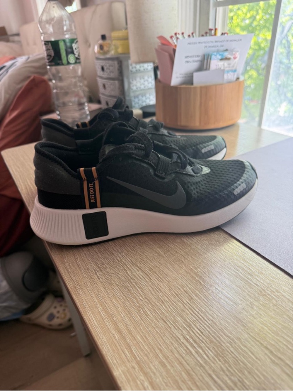 NIKE Black and Gold Low-Top Sneaker